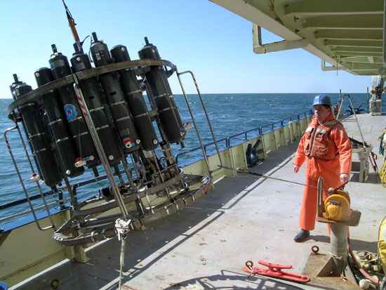 A CTD, to measure conductivity, temperature and density of seawater, is deployed from research vessel Oceanus during a harmful algal bloom cruise.