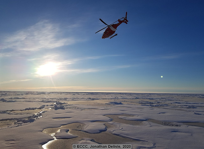 The helicopter flies off for ice reconnaissance.