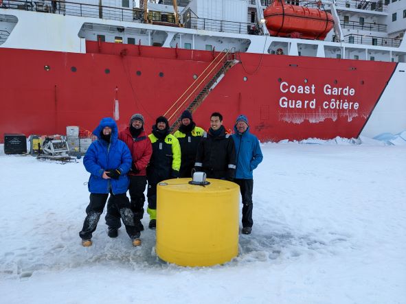The mooring operation team in front of a Tethered Ocean Profiler after its deployment (from left to right: Mary-Louise Timmermans, Jeff O'Brien, John Jordon, Jim Ryder, James Kuo, Mike DeGrandpre) (Photo by Gary Morgan).