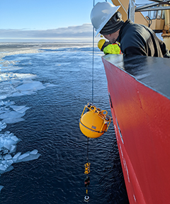 Mike DeGrandpre watching the recovery of a mooring. The SAMI-CO2 is located below the yellow sphere (Photo by Mary-Louise Timmermans).