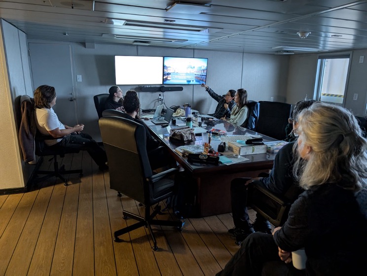 Magali Pucet gives a scientific presentation on her dissertation research analyzing data from our yearly cruises, including this year (Photo by Mary-Louise Timmermans)