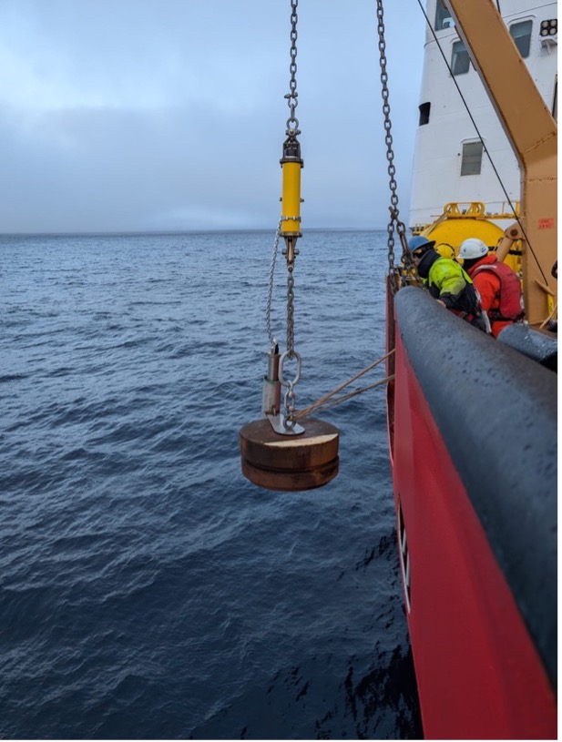 The mooring anchor goes over the side to begin the final mooring deployment of the cruise (Photo by Mary-Louise Timmermans) 