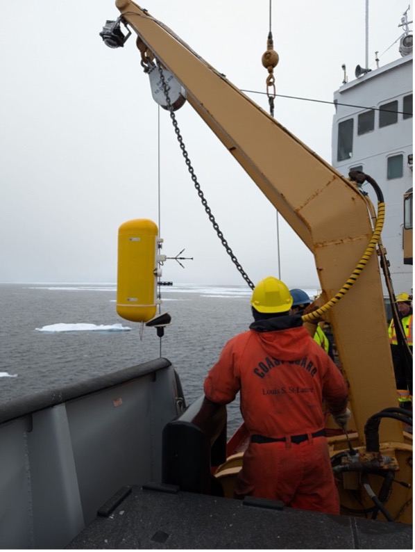 The moored profiler (which will measure velocity, temperature, salinity, and pressure on the mooring) is deployed (Photo by Mary-Louise Timmermans)