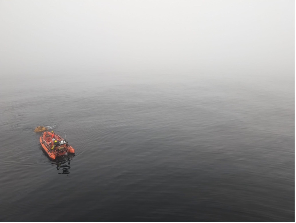 The FRC hooks onto the mooring top float- in the fog (Photo by Mary-Louise Timmermans) 