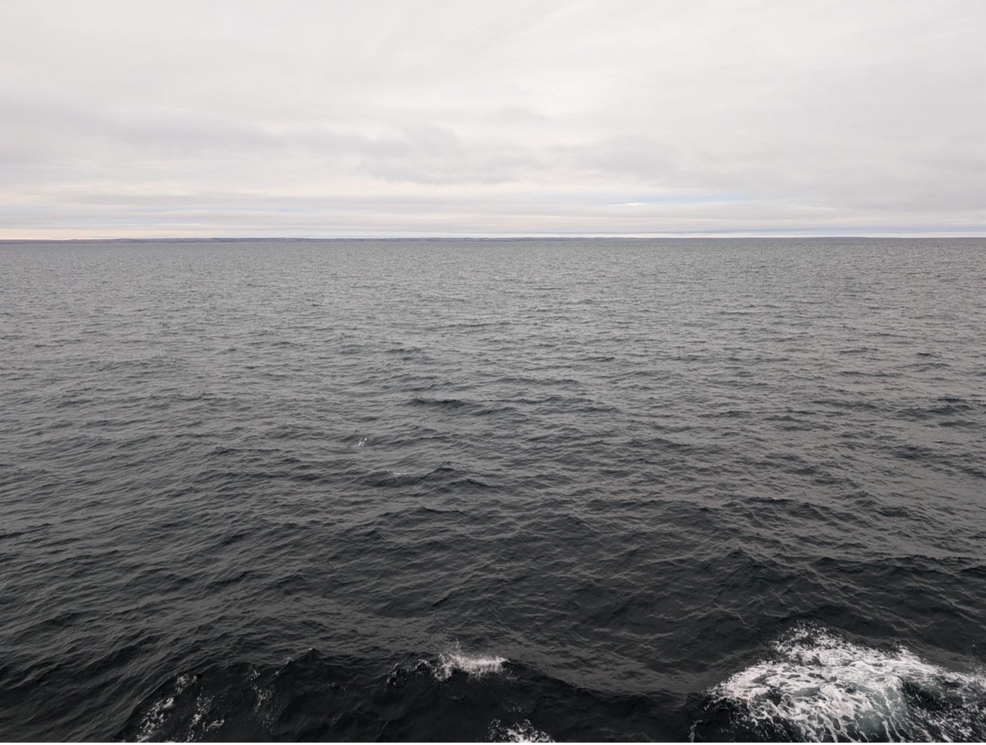 Our first glimpse of land on the horizon in Dolphin and Union Strait (Photo by Mary-Louise Timmermans)