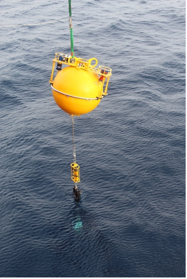 The mooring suspended over the ocean right before its release from the ship (Photo by Paul Macoun)