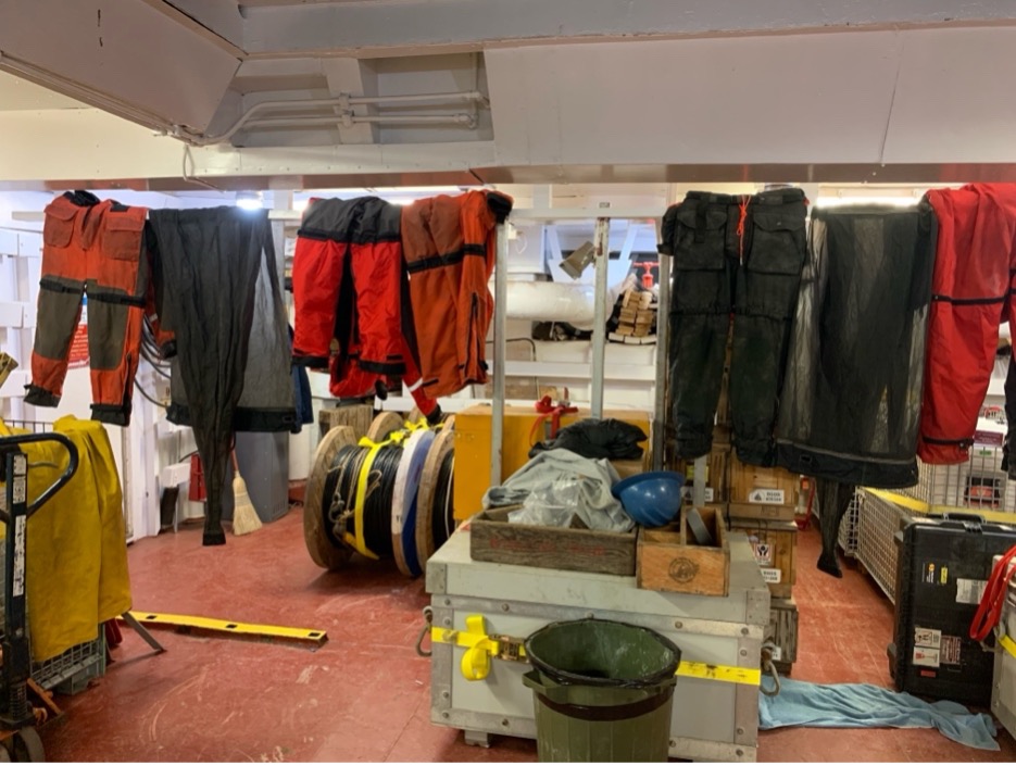 The mustang suits and bongo nets hanging to dry in the forward hold