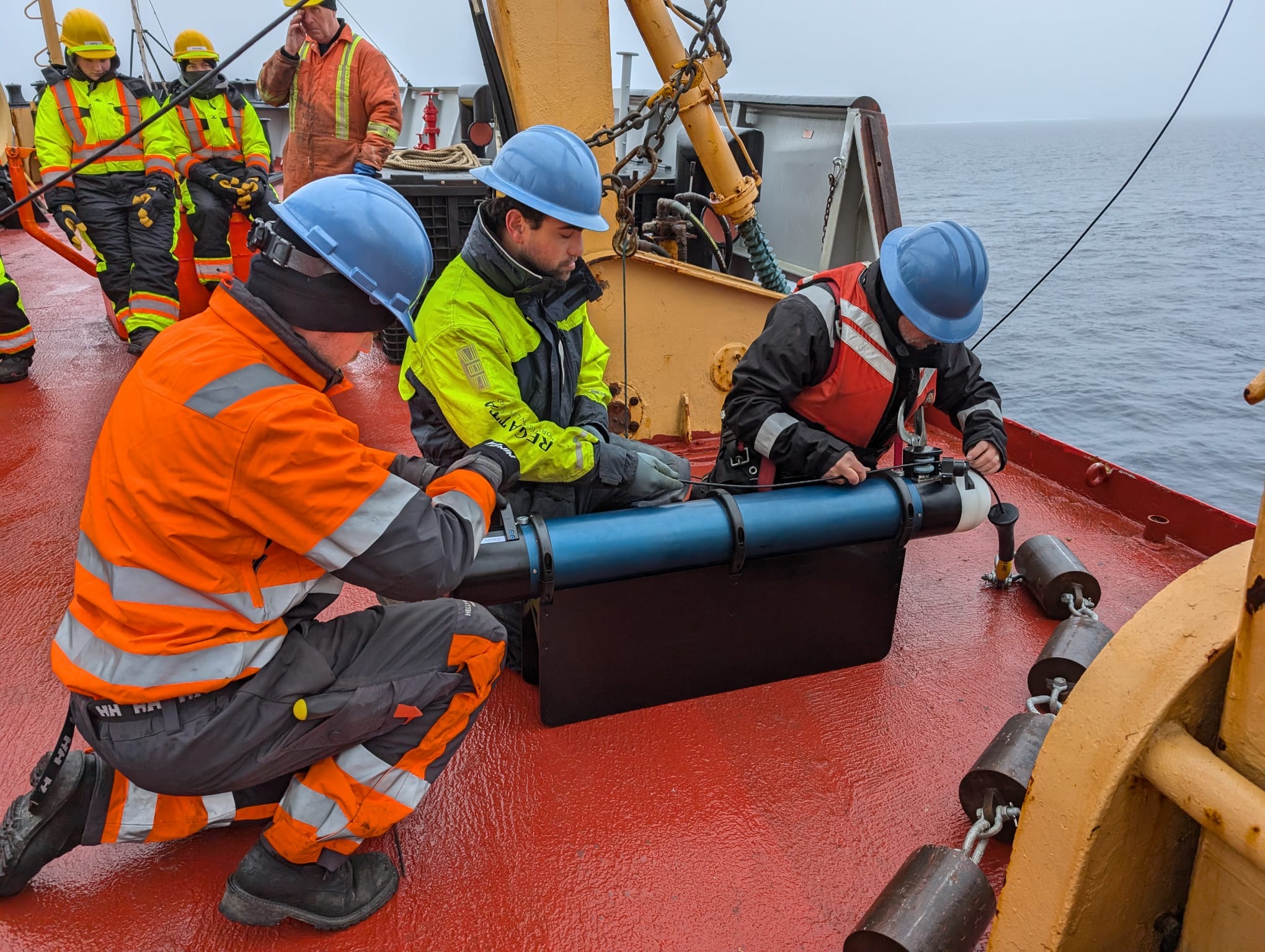 Tim McDonough, Nico Llanos, and Jeff O’Brien prepare the TOP for deployment (Photo by Mary-Louise Timmermans)