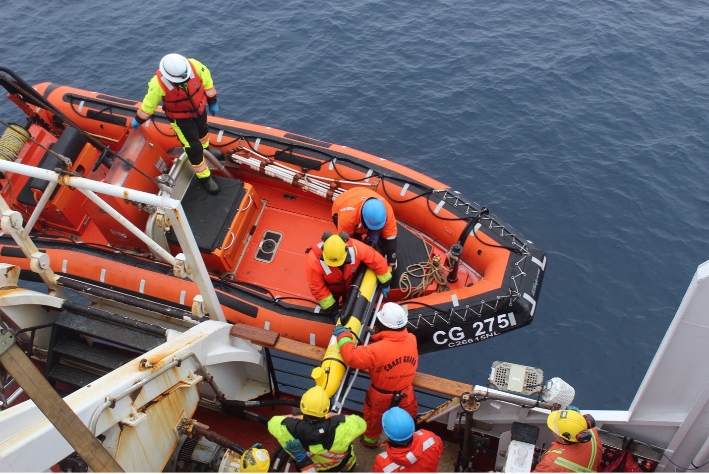 Mike is brought back aboard the Louis (Photo by Paul Macoun) 