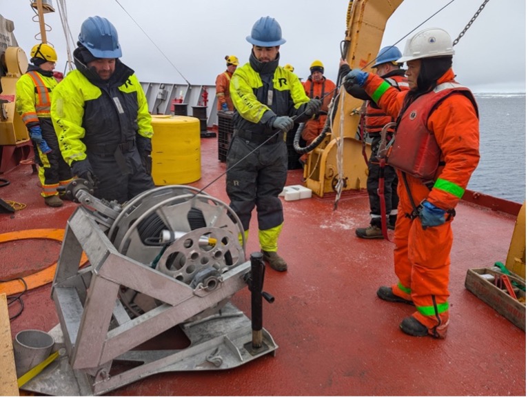 Bosun Rico Amamio, Nico Llanos, and Eric Trotto pay out wire during the TOP deployment