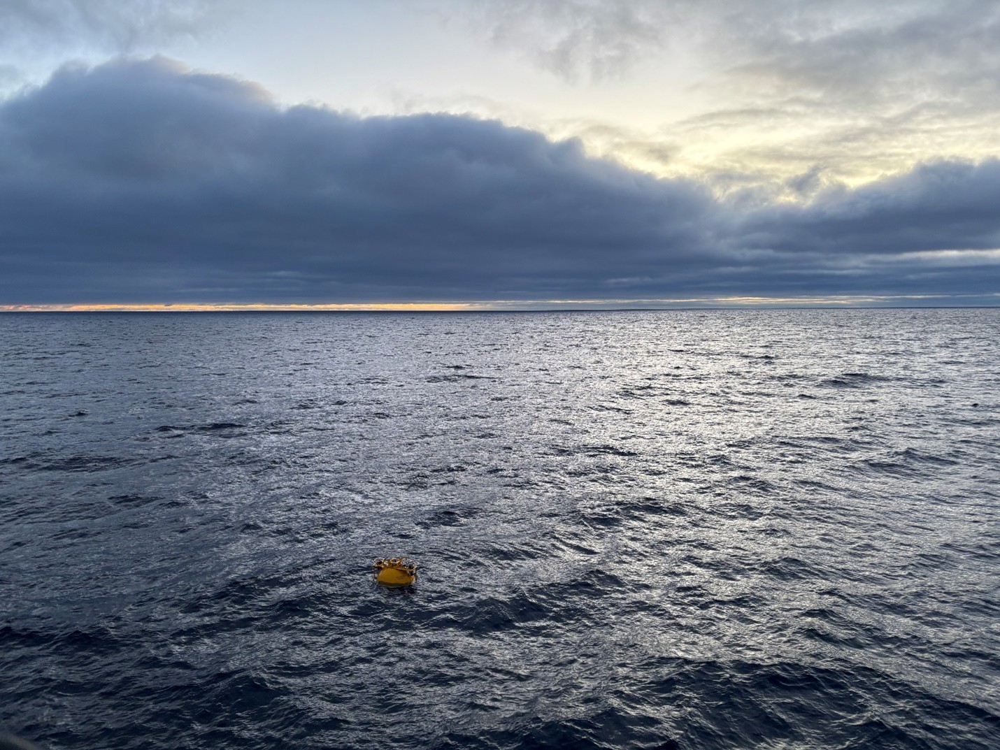 Photo 1: Mooring A’s top sphere surfaced minutes after Jeff O’Brien released it from the bottom anchor.  