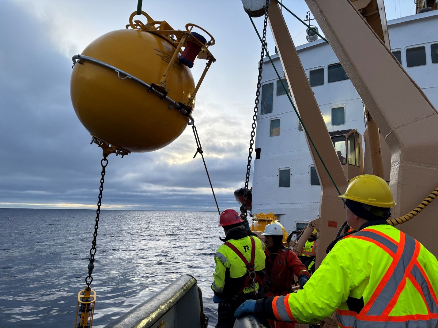 Photo 2: Mooring A’s top sphere being brought on deck after being clipped into the winch by Jerome Sibley. 