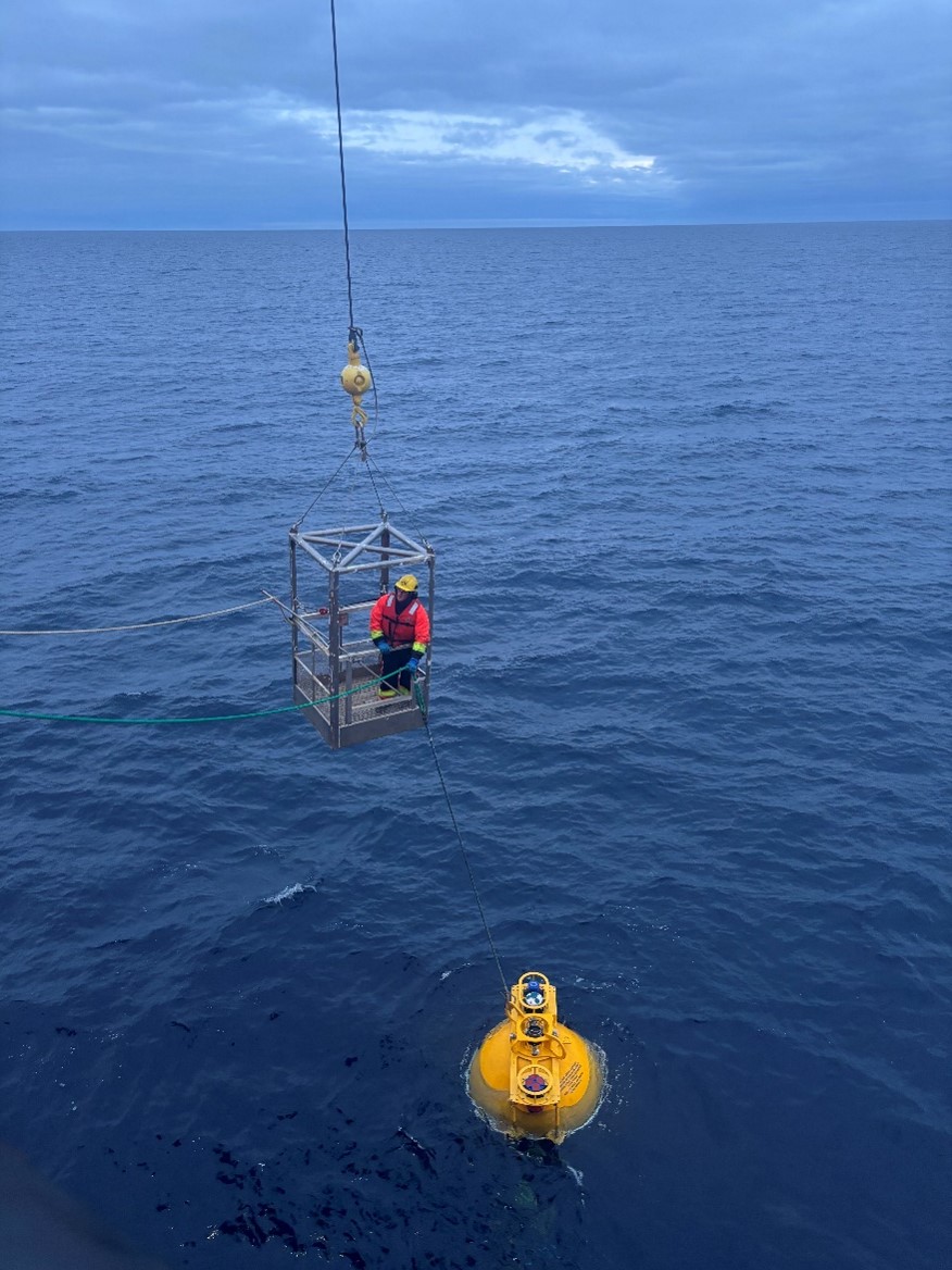 Photo 1: Deckhand Jerome Sibley clipping Mooring D into the winch. 