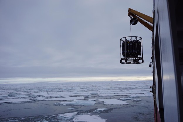 Photo 2: The CTD rosette being lowered into the water at CB-51. Photo by Collette Leclerc. 