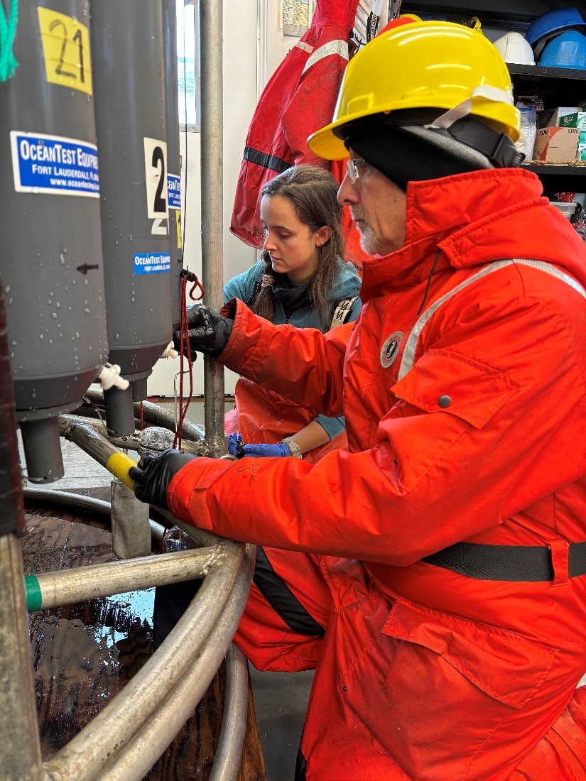 Photo 4: Andrew Ross (right) and Annabel Payne (left) drawing CFC12/SF6 water samples.  