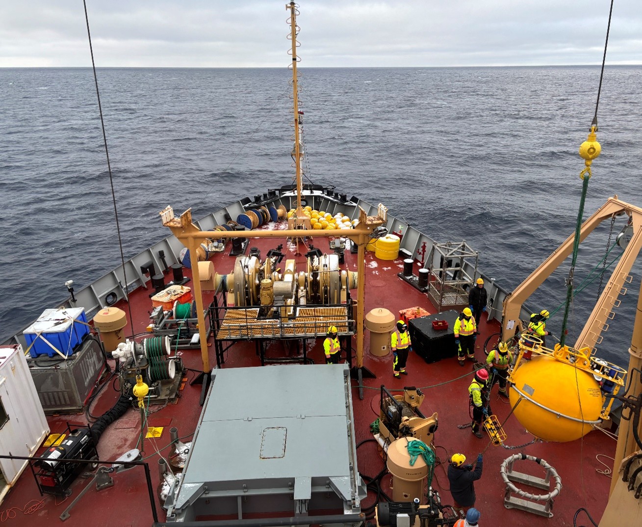 Photo 4: Mooring A’s top sphere being lifted for deployment, as seen from the bridge. 