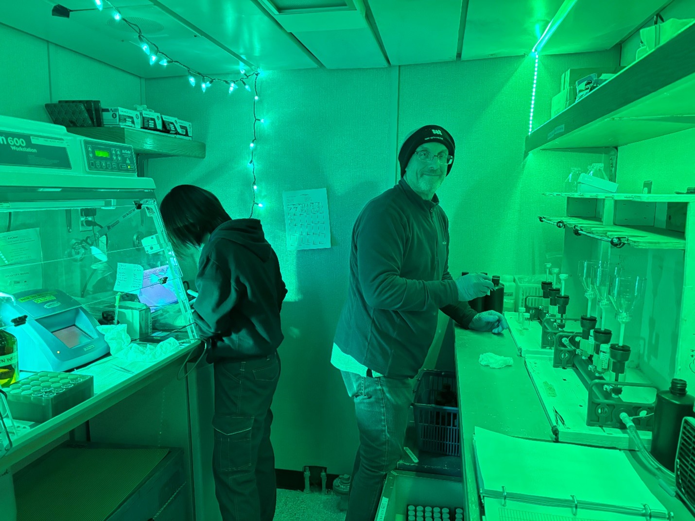 Photo 4: Yuanxin Zhang (left) and Andrew Ross (right) filtering and processing samples in the chlorophyll lab. 