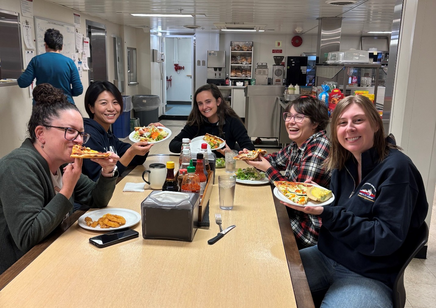 Photo 4: Pizza night on the Louis! (left to right: Sarah-Ann Quesnel, Yuanxin Zhang, Annabel Payne, Erinn Raferty, Dominique Baker). 
