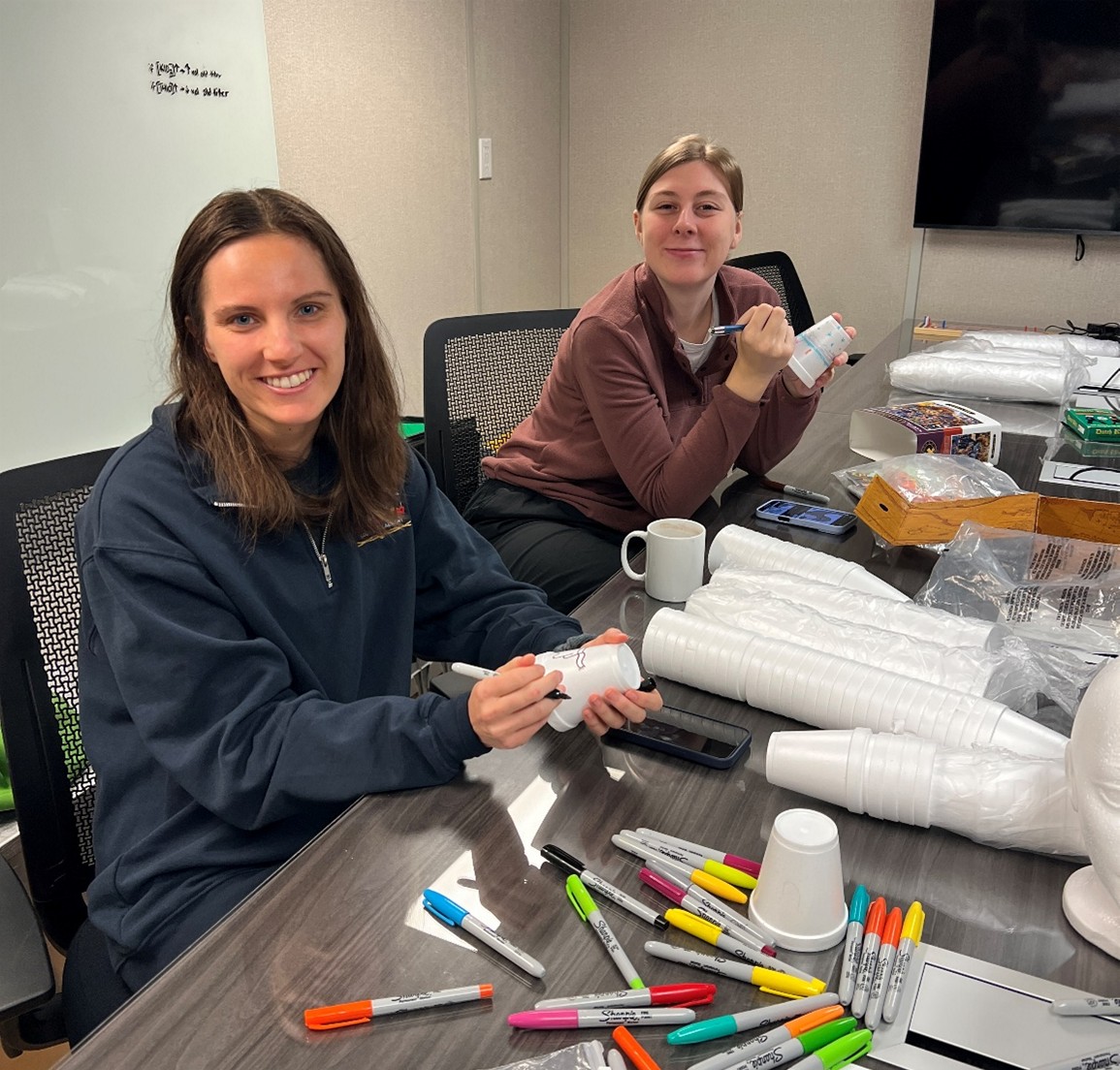 Dispatch18Photo3 Photo 3: Jennifer Kosty (left) and Dominique Baker (right) decorating styrofoam “shrinky” cups. Photo by Annabel Payne.