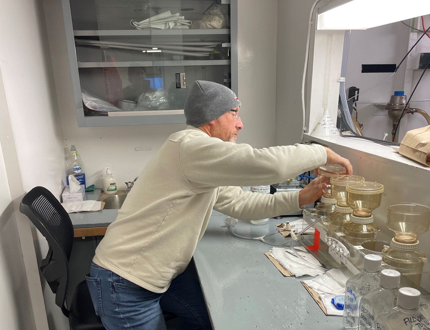 Dispatch31Photo4 Photo 4: Andrew Ross preparing to filter biotoxin samples on the Louis. Photo by Paul Macoun.