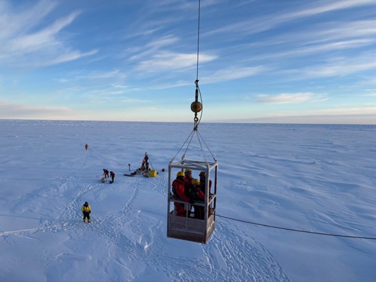 Picture3 Photo 1: Andrew Ross, Dominique Baker, Annabel Payne, and Céline Guéguen being lowered to the ice via the man-basket.