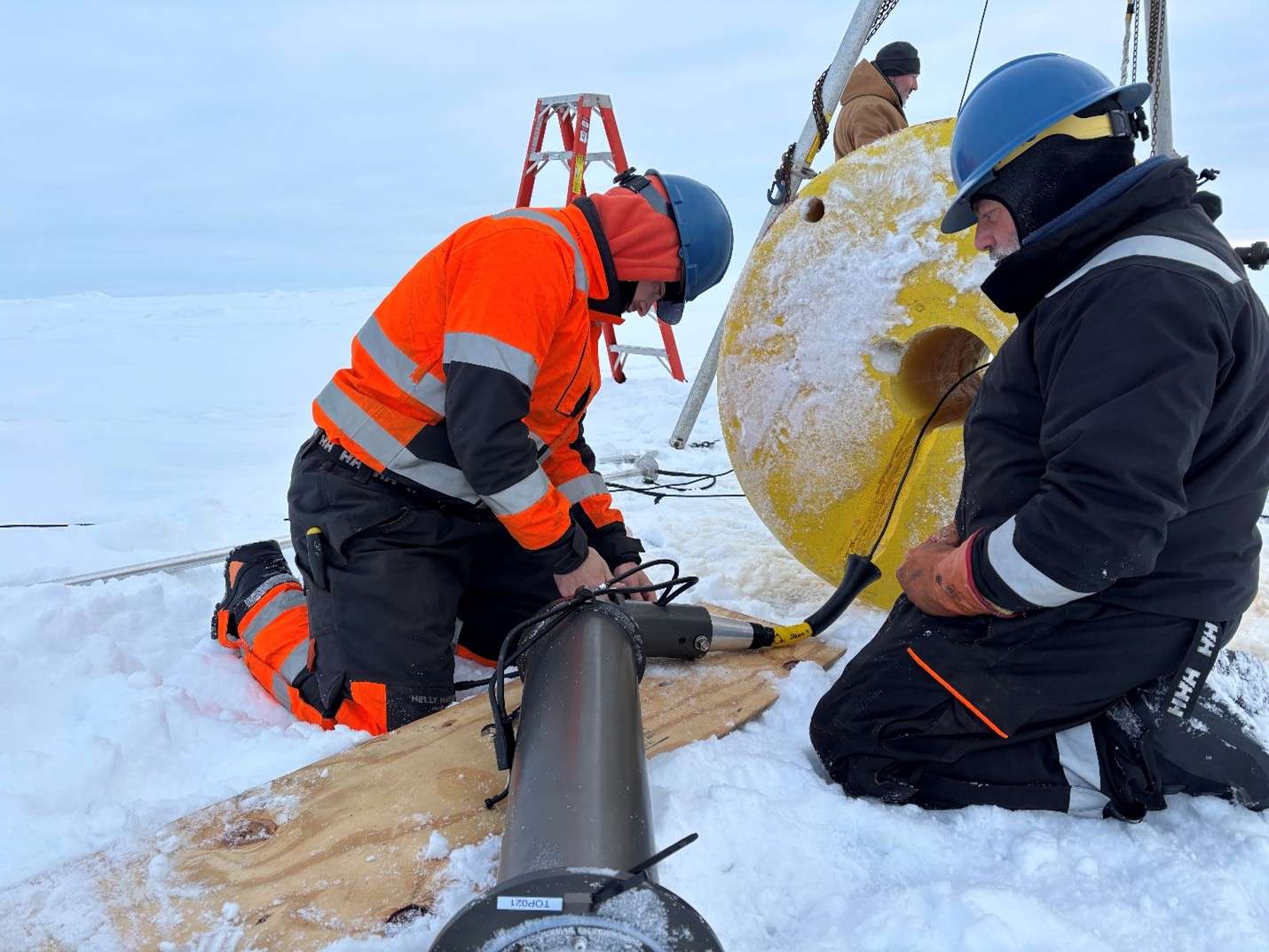 Picture4 Photo 2: Tim McDonough (left) and Jeff O’Brien (right) preparing TOP21’s surface instrument package prior to deployment.