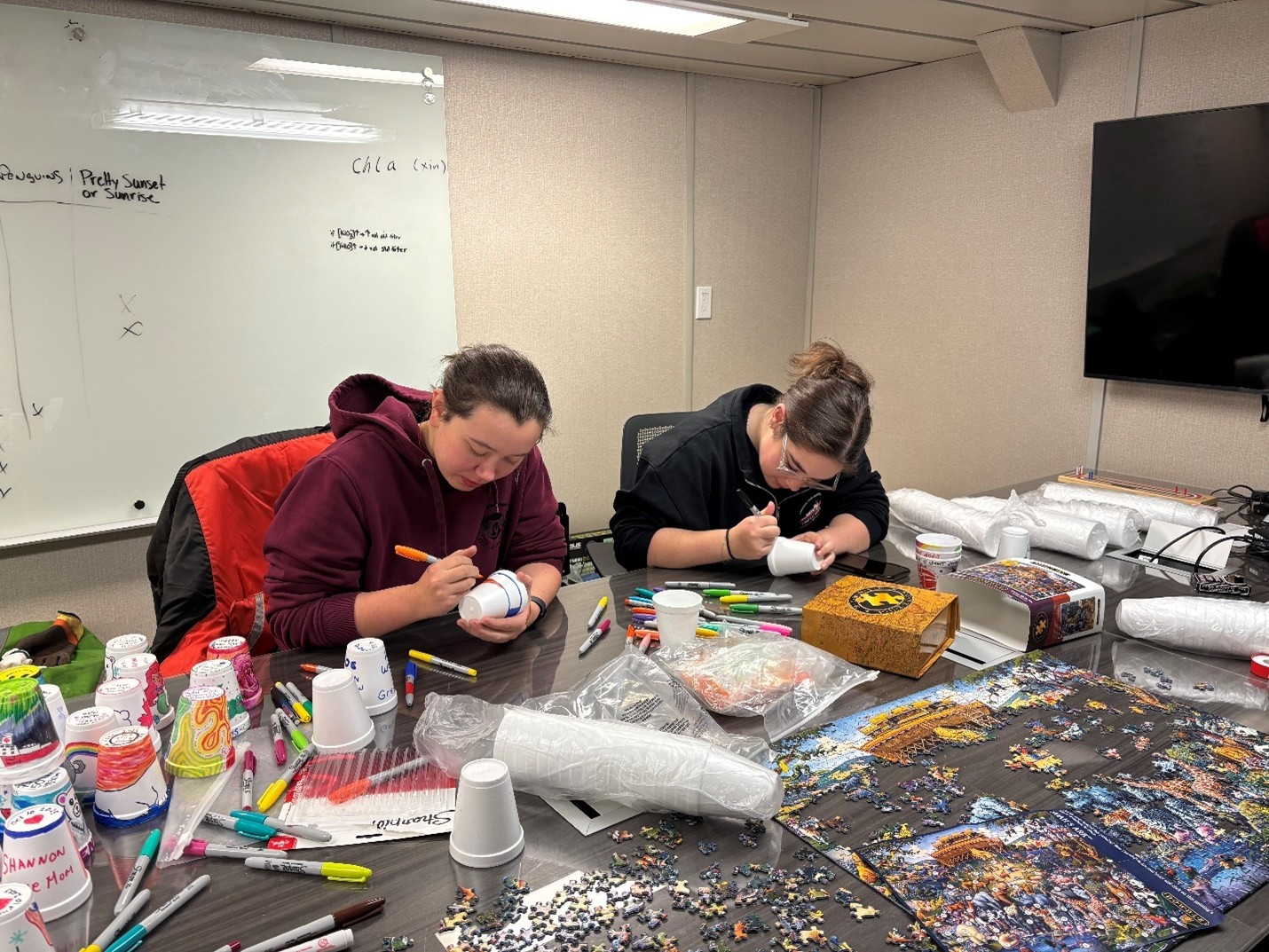 Picture6 Photo 4: Cadets Kyla Wallace (left) and Olivia Butt (right) decorating “shrinky” cups.
