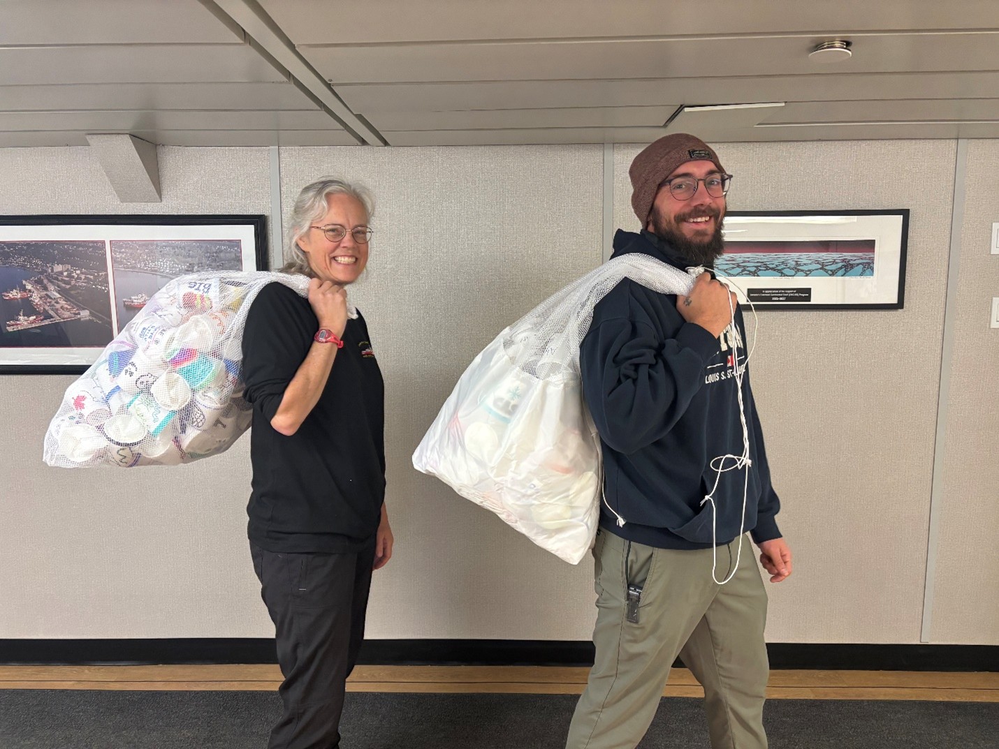 Picture6 Photo 3: Sarah Zimmermann (left) and Chris Clarke (right) posing with the decorated styrofoam “shrinky” cups before they were sent to the bottom of the Arctic Ocean.