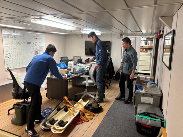 Picture7 Photo 3: (left to right) Shotaro Muraoka, Michiharu Shibata, and Takuji Waseda packing their ice observing equipment.