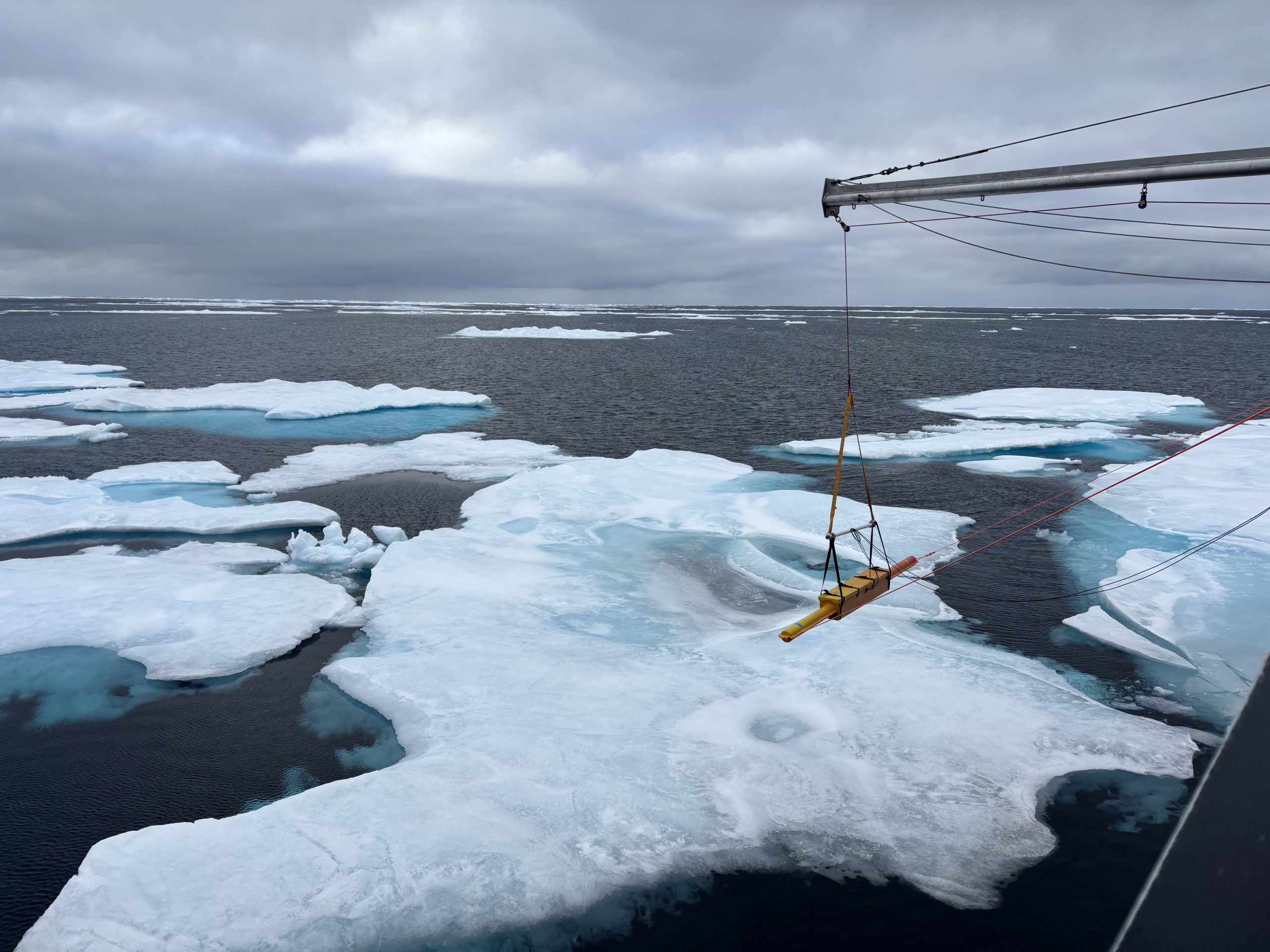 The “sushi” recording measurements of sea ice thickness off the foredeck. Photo by Jennifer Kosty. 