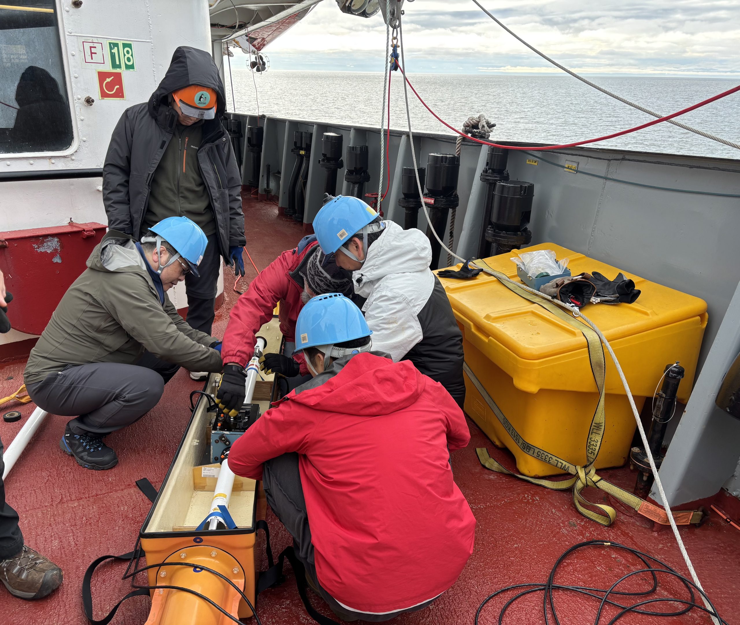 Kazu Tateyama, Hayate Kato, Takuji Waseda, Koya Sato, and Jeff O’Brien preparing to deploy the “sushi”. Photo by Jennifer Kosty. 