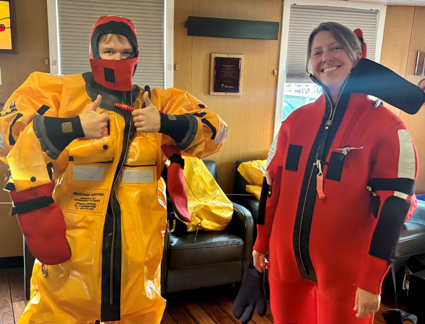 Chloe Immonen and Monika Loevenmark trying on their immersion suits. Photo by Jennifer Kosty.