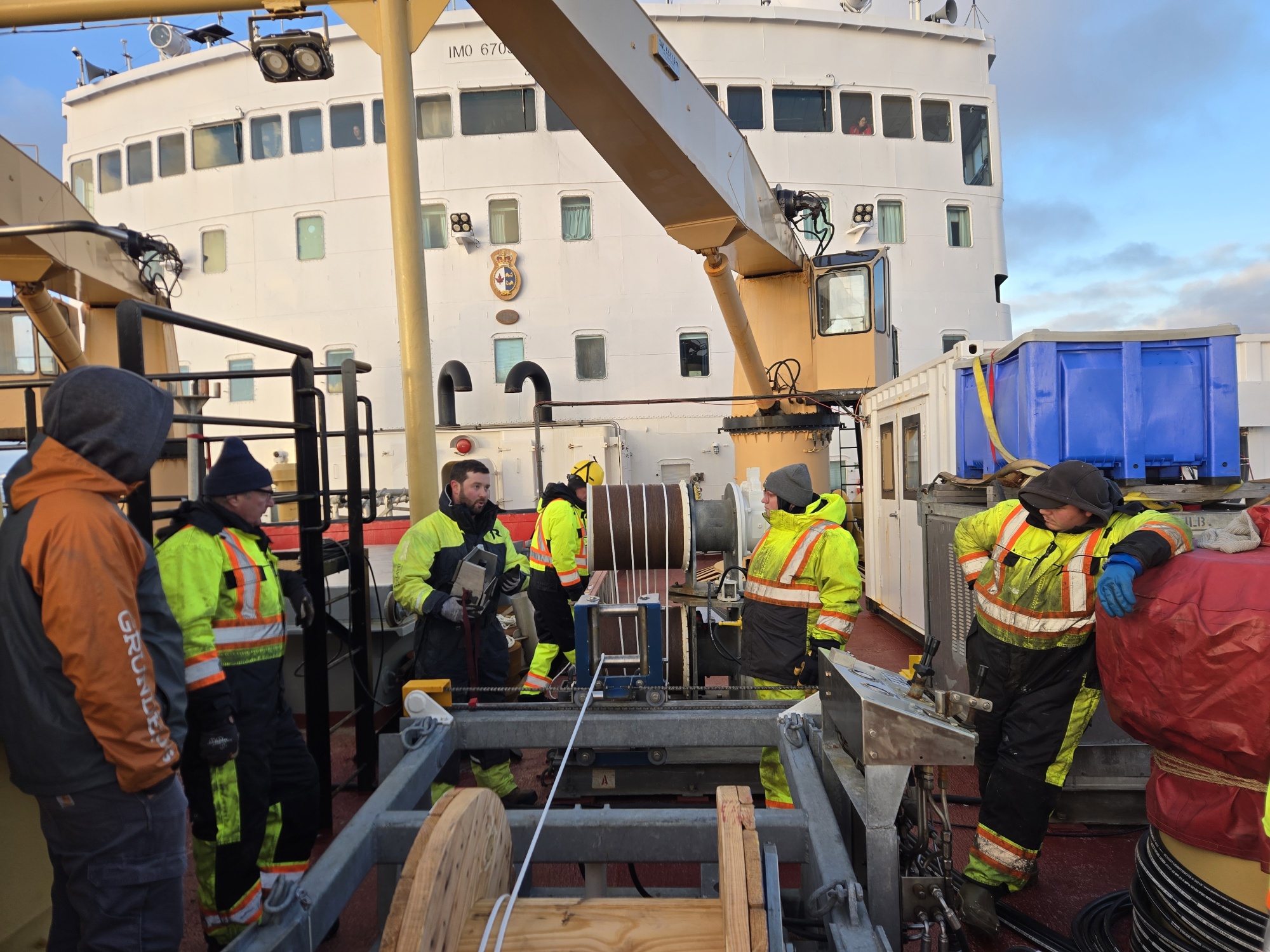 Chris Basque and the WHOI team conducting a winch training session for the upcoming mooring recovery and deployment. Photo by Jeff O’Brien. 