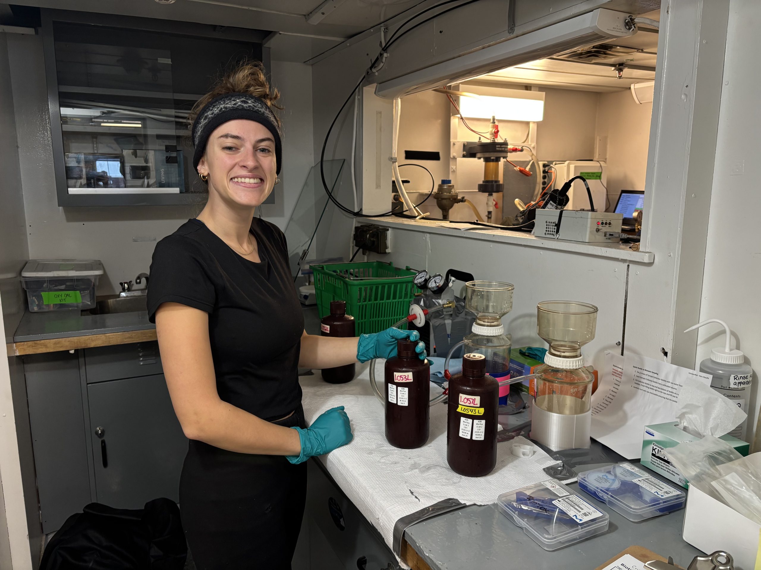 Mackenzie Mueller filtering biotoxin samples. Photo by Jennifer Kosty. 