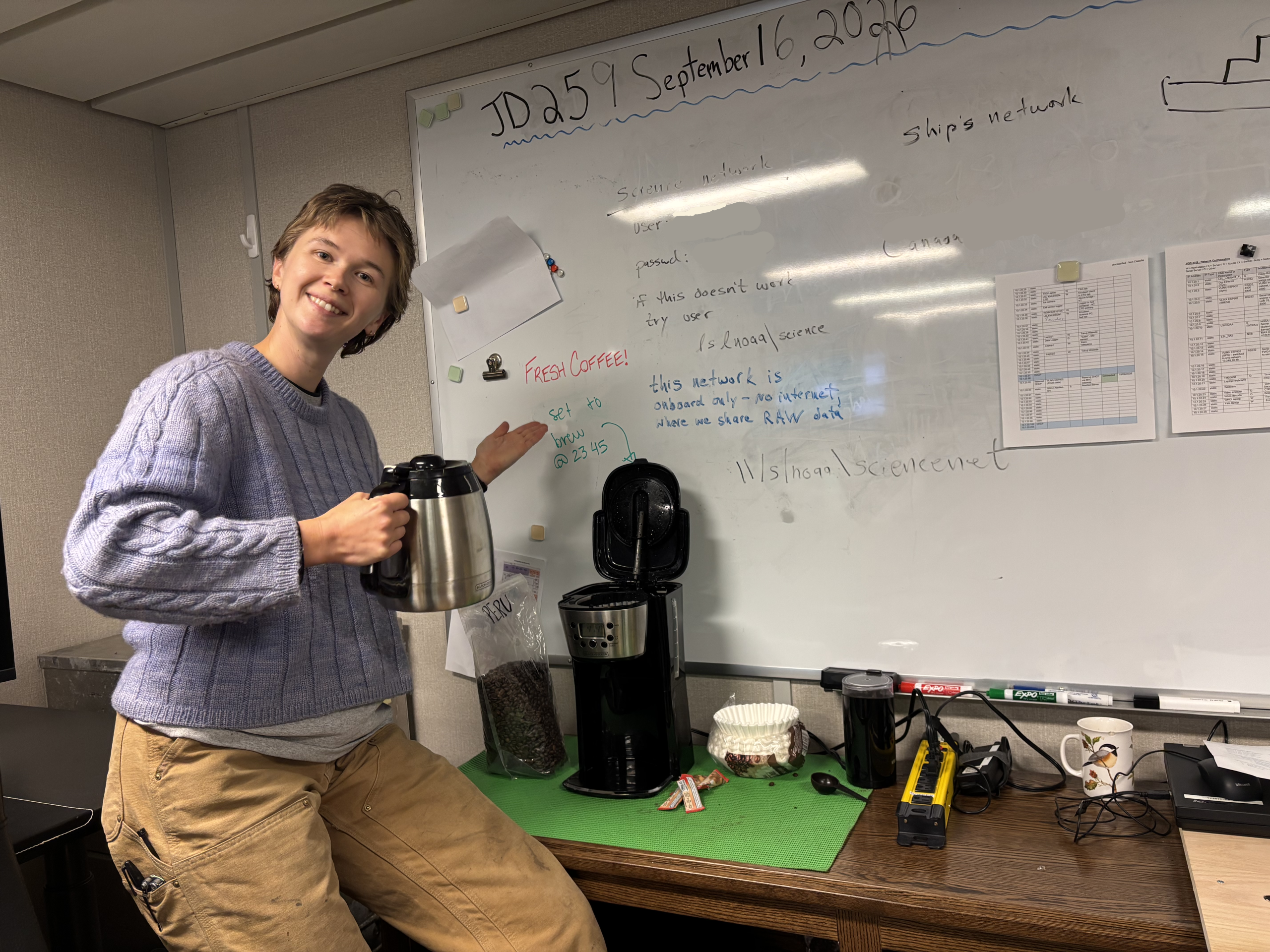 Chloe Immonen showing off the boardroom coffee set up. Photo by Jennifer Kosty.