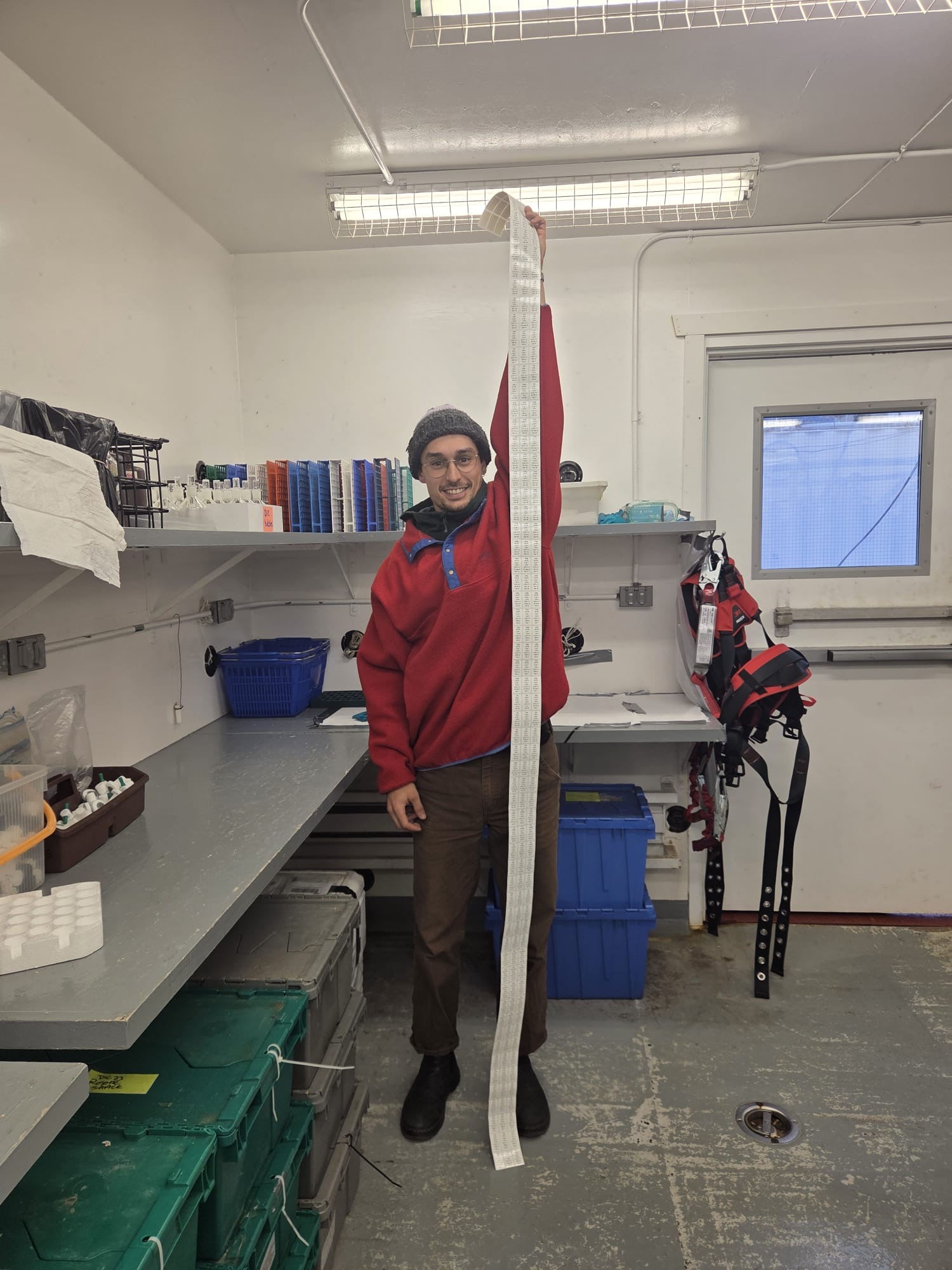 Kalum Delaney showing the large number of sample labels used in a single CTD-rosette cast! Photo by Collette Leclerc. 