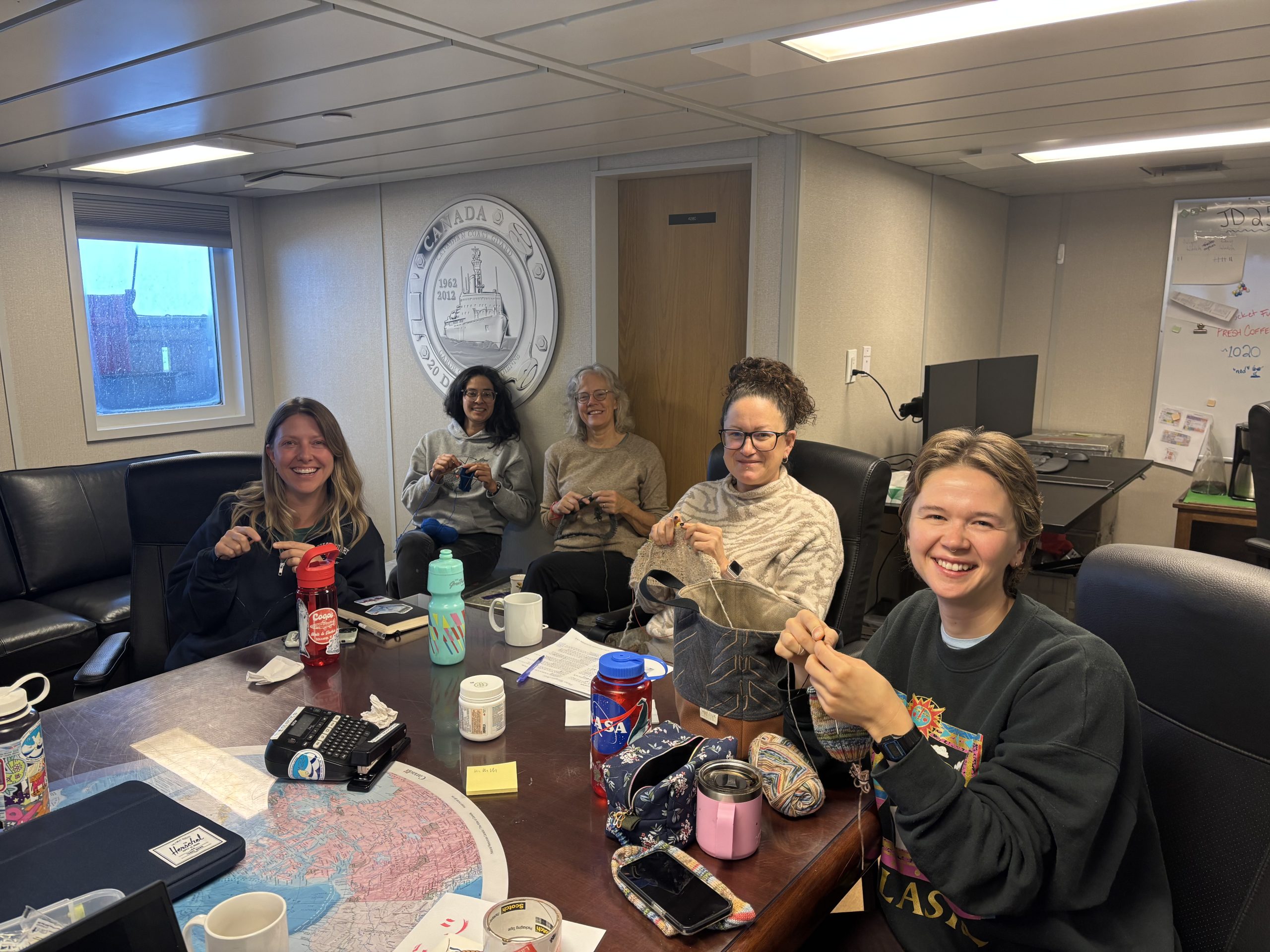 Members of the science team crafting in the boardroom. Photo by Jennifer Kosty. 