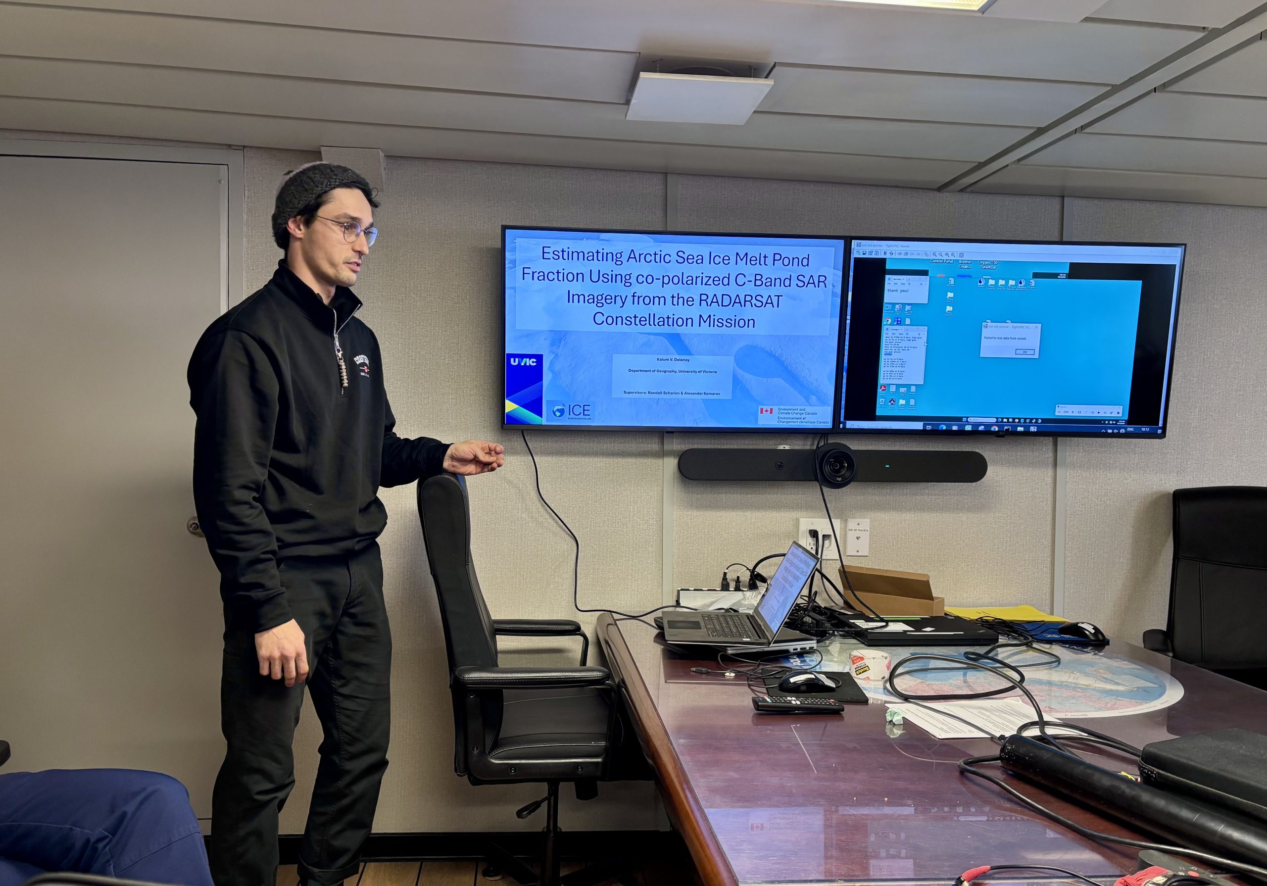 Kalum Delaney giving a presentation during the daily science meeting. Photo by Jennifer Kosty. 