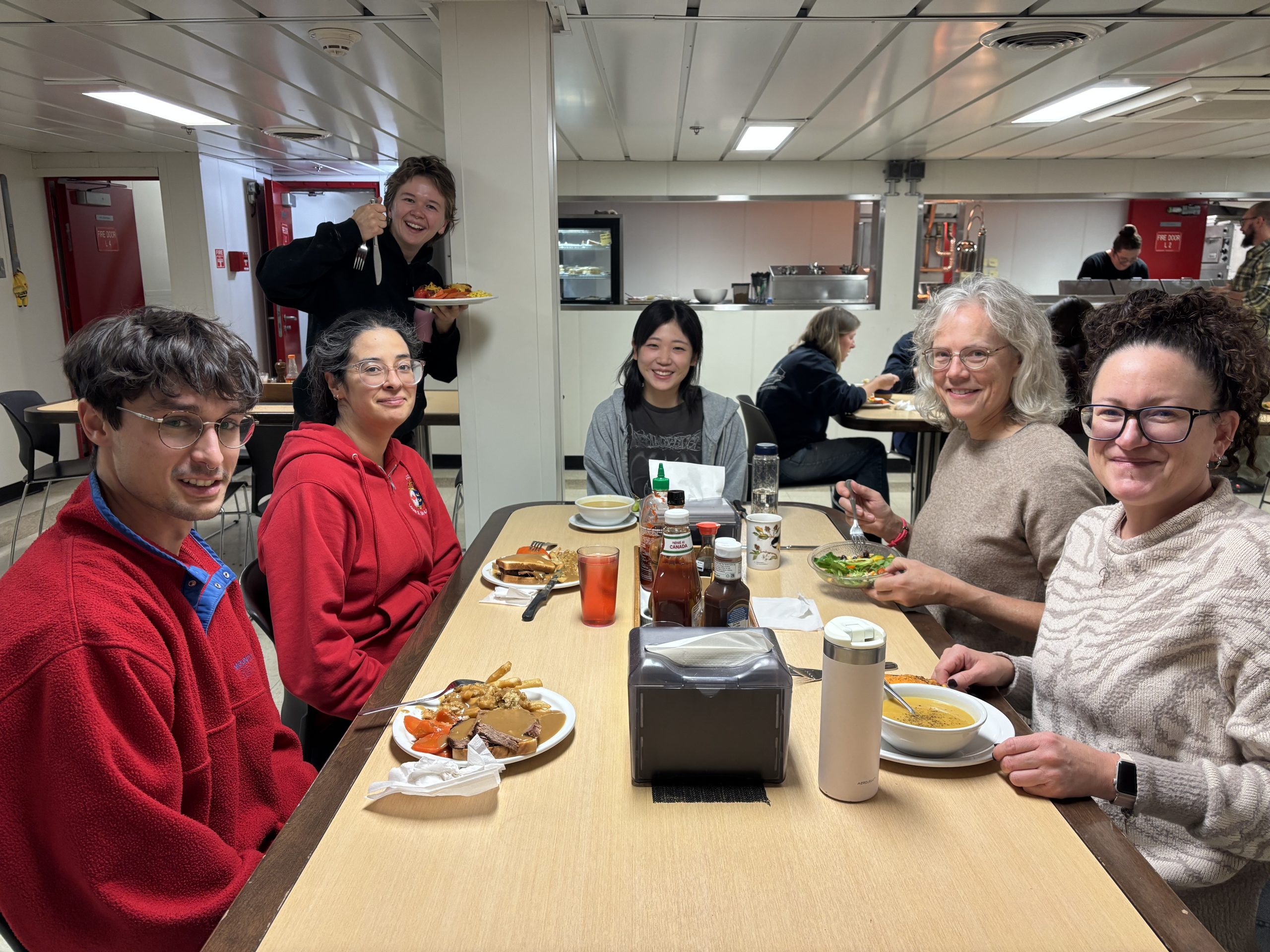 Members of the science team enjoying lunch in the mess. Photo by Jennifer Kosty. 