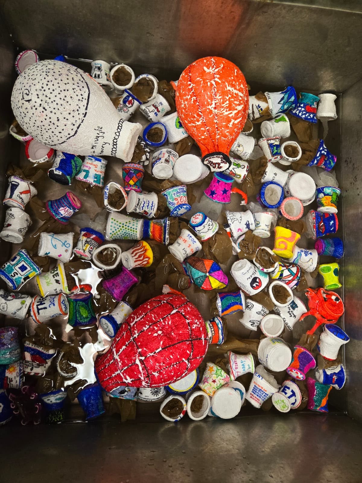 The shrinky cups getting a quick freshwater bath after their journey to the bottom of the Arctic Ocean. Photo by Francesca Loro. 
