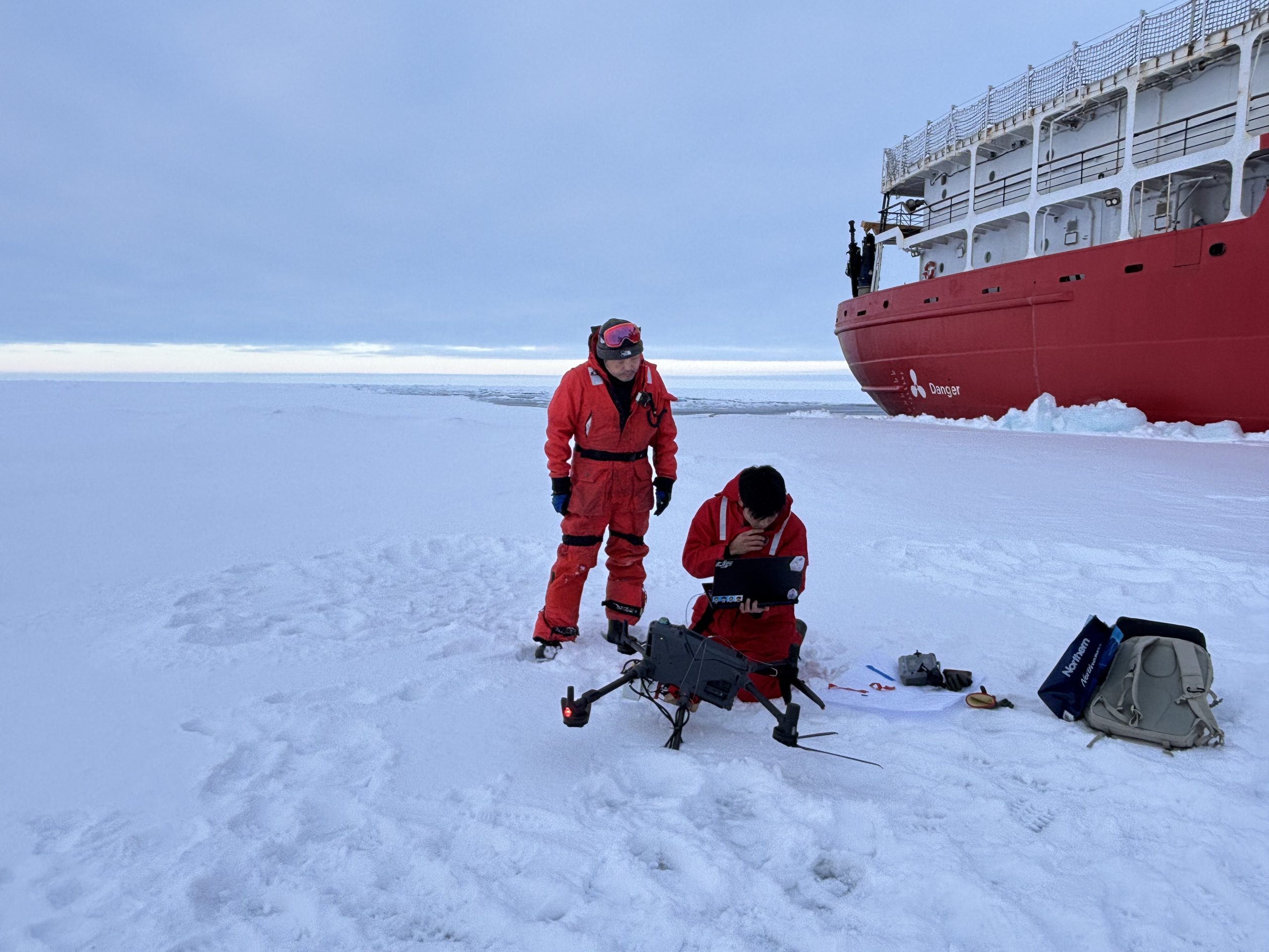 Kazu Tateyama and Hayate Kato preparing to conduct a drone-survey of the ice. Photo by Jennifer Kosty.