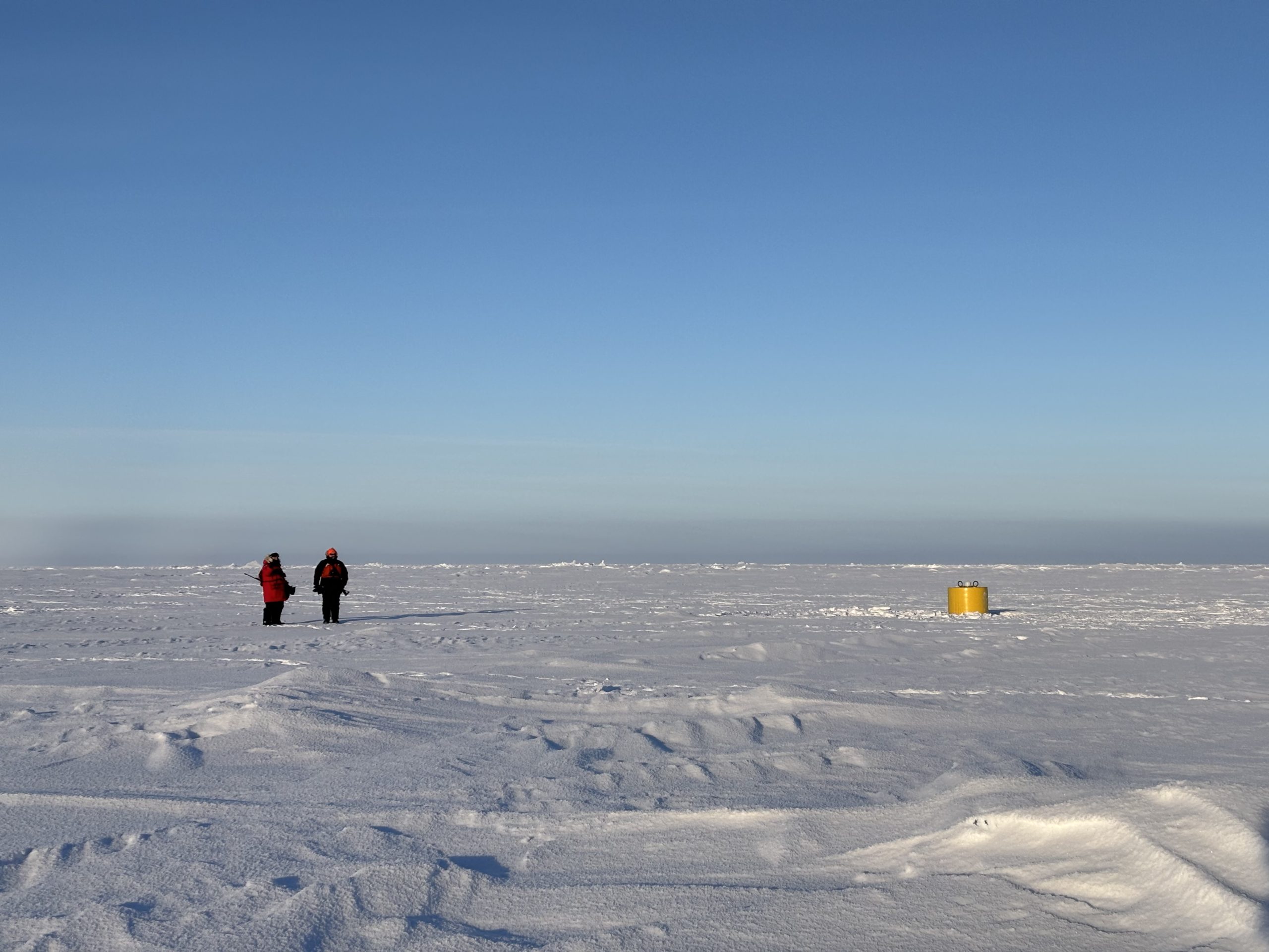Our polar bear guards pictured with the tethered ocean profiler (TOP) after its deployment. Photo by Jennifer Kosty. 