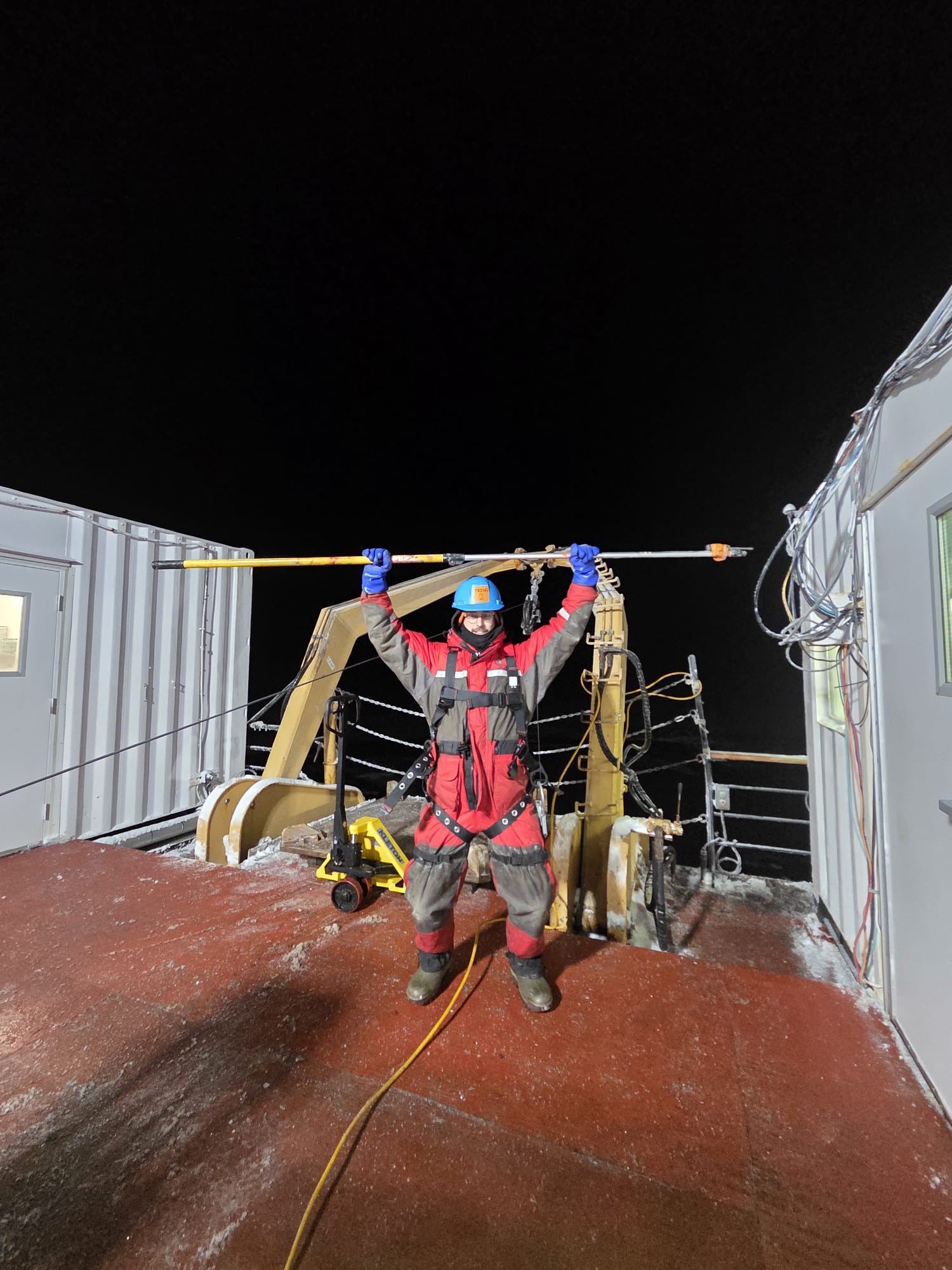 Kalum Delaney protecting the rosette wire block from ice buildup. Photo by Clement Feriot. 