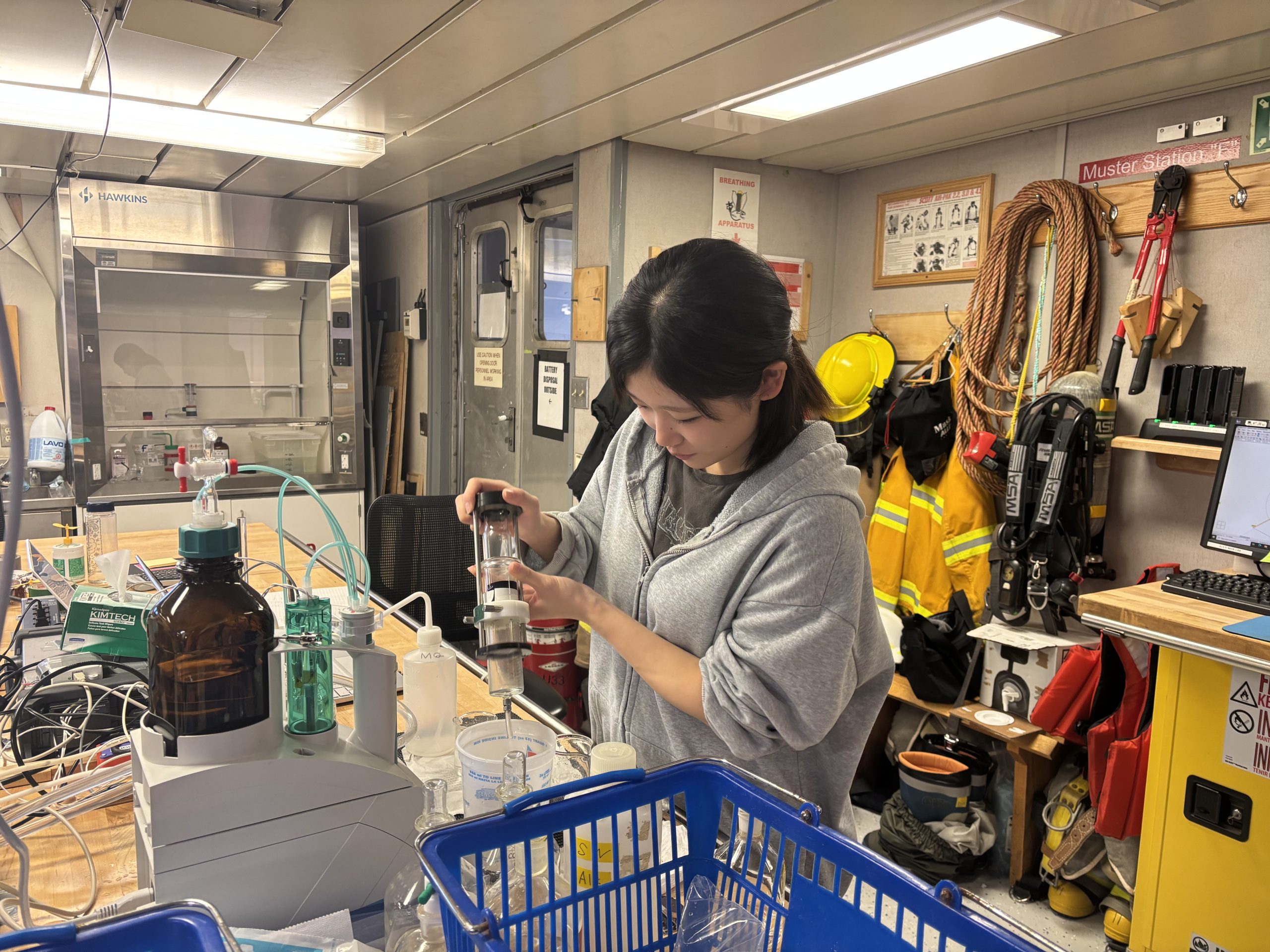 Tsukushi Komura processing an alkalinity water sample. Photo by Jennifer Kosty. 