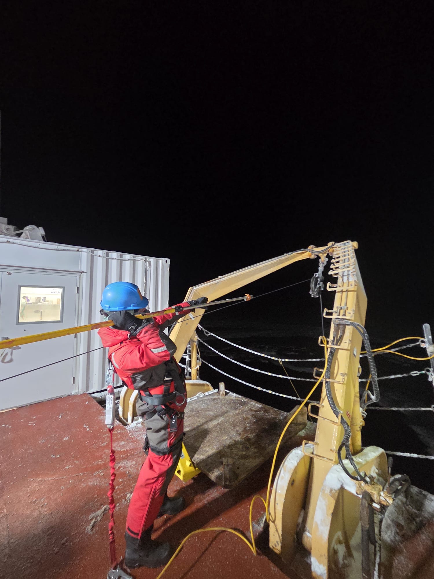Kalum Delaney removing ice from the rosette wire. Photo by Clement Feriot.  