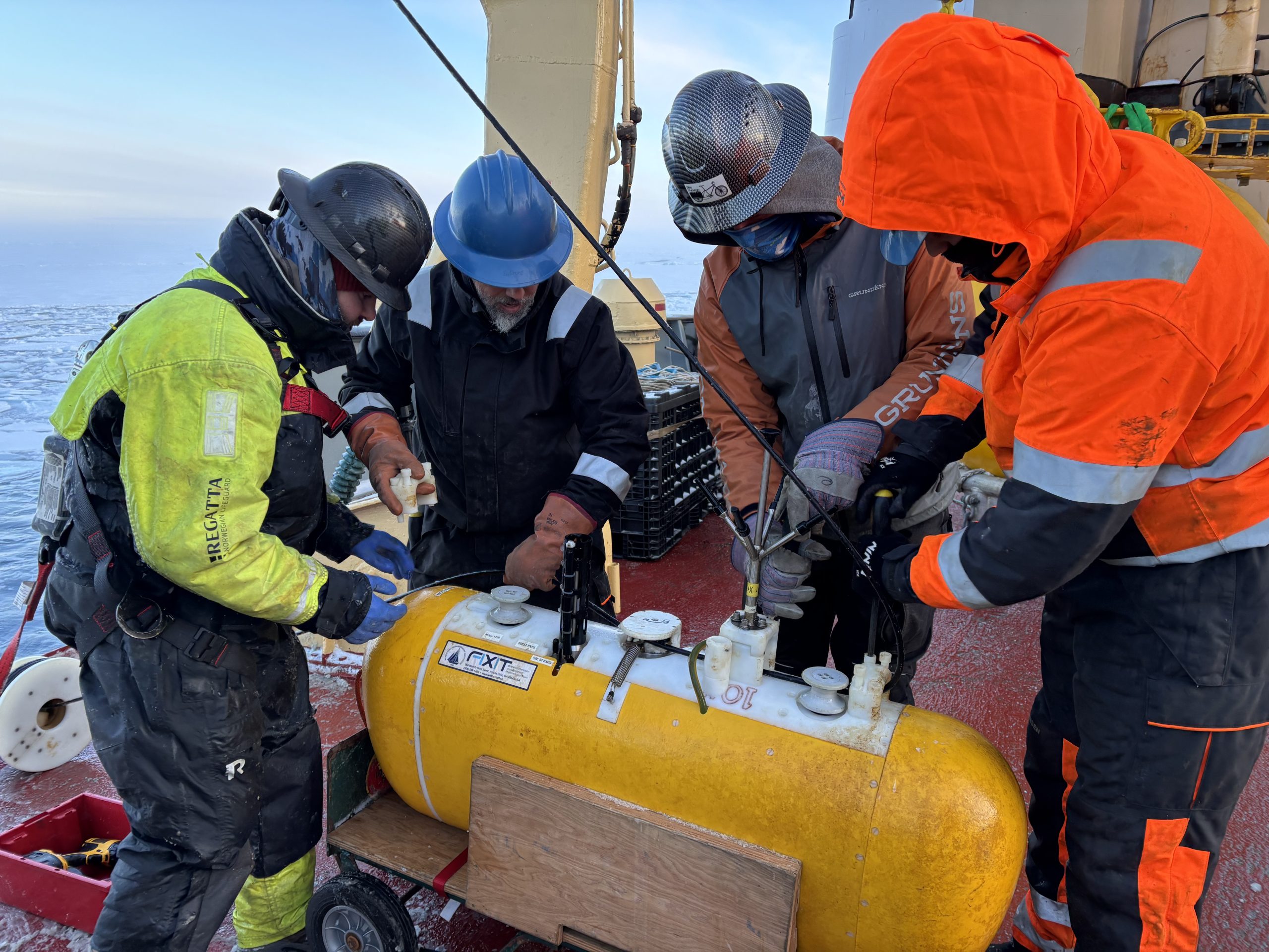 (left to right) Chris Basque, Jeff O’Brien, Eric Hutt, and Tim McDonough recovering one of Mooring B’s McClane Moored Profilers (MMPs). Photo by Jennifer Kosty. 