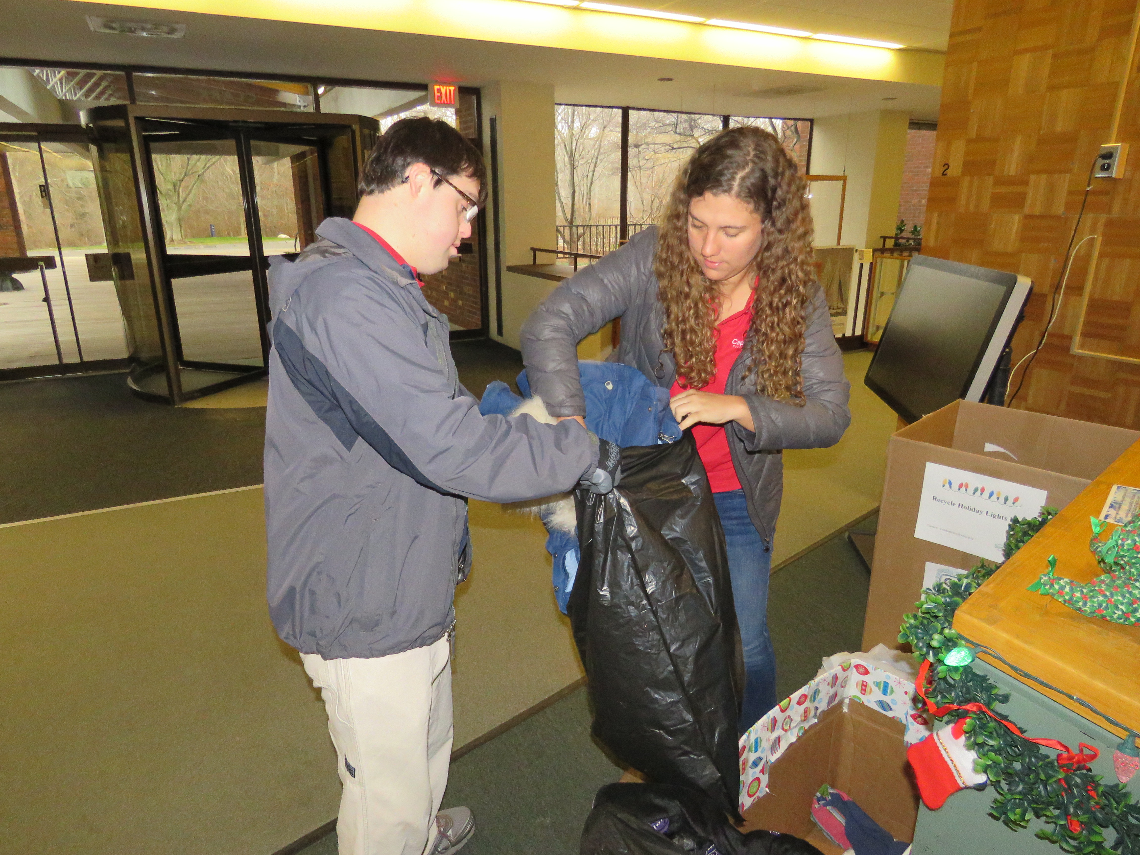 workers collecting coats for coat drive