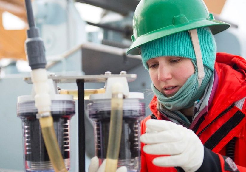 Lauren Kipp, a graduate student in the MIT-WHOI Joint Program in Oceanography, led efforts to measure radium-228 in the Arctic Ocean. The naturally occurring isotope is used to track the flow of material from land and sediments into the open ocean. Here, she removes a cartridge from a sampling instrument that pumps seawater through the cartridges to collect chemical isotopes. (Cory Mendenhall, U.S. Coast Guard)