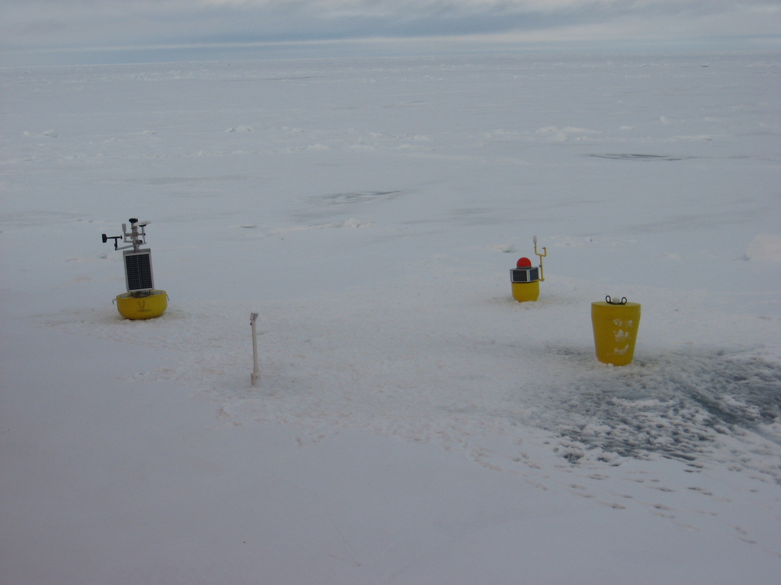 Second and last Ice-Based Observatory deployed during NABOS 2015 consisting of (from left to right) O-Buoy, S-IMB, AOFB, and ITP 92 as deployed. (Photo by Frank Bahr)