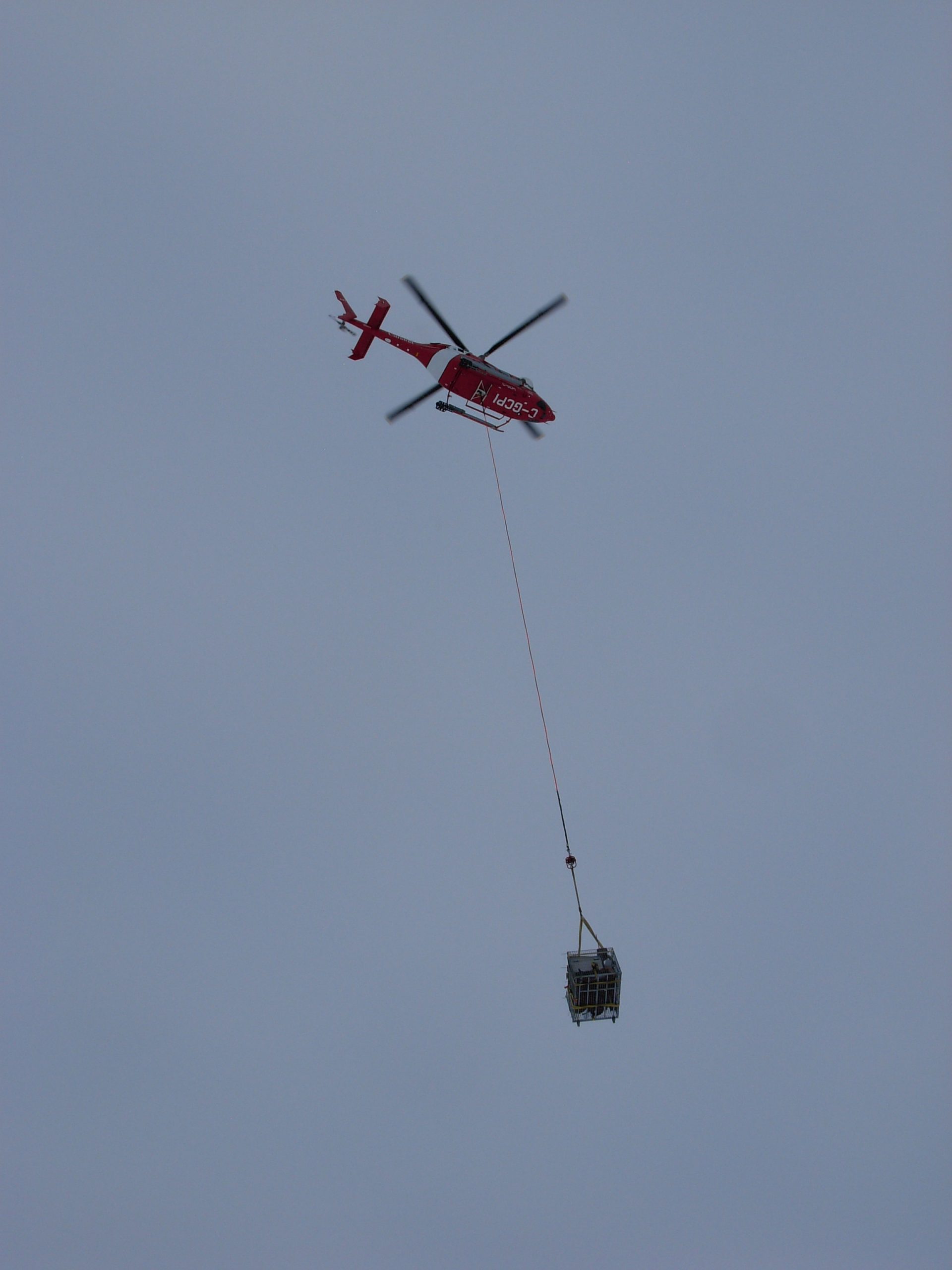 Transportation of gear to the floe using the ship’s helicopter.  (Photo by Rick Krishfield)